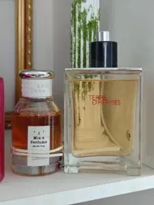 Side-by-side comparison of a luxury designer fragrance and a high-quality Un Jardin Sur La Lagune dupe