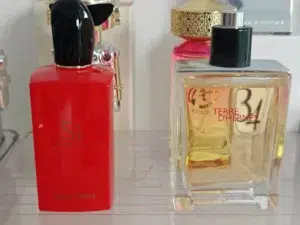 Giorgio Armani Si Eau de Parfum bottle compared next to IMIXX Inspired by Si, highlighting the difference between traditional retail and factory-direct fragrances.