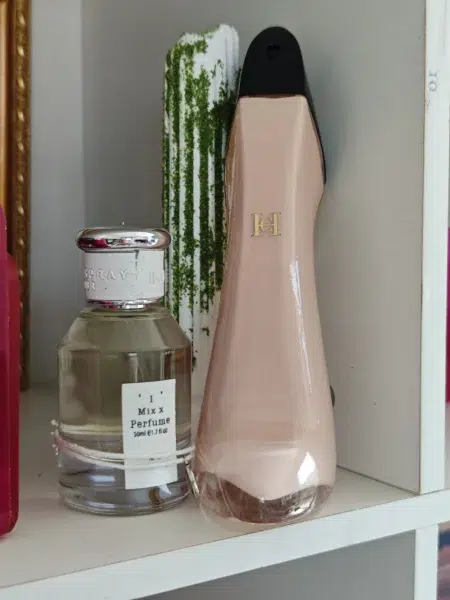 Side-by-side comparison of the original Carolina Herrera Good Girl stiletto bottle and a premium factory-direct perfume dupe.