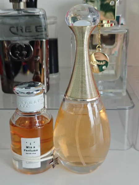 Side-by-side cost and performance comparison of an expensive luxury designer perfume and a high-quality Dior J'adore dupe.