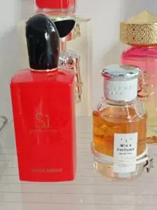 Side-by-side price and packaging comparison of a $150 designer luxury perfume and a high-quality affordable Armani Si alternative.
