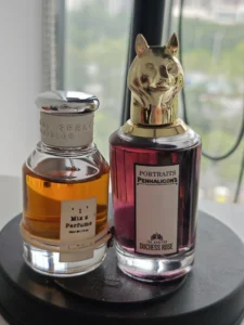 A side-by-side comparison of a luxury Penhaligon's Duchess Rose bottle and a high-quality affordable woody rose perfume alternative.