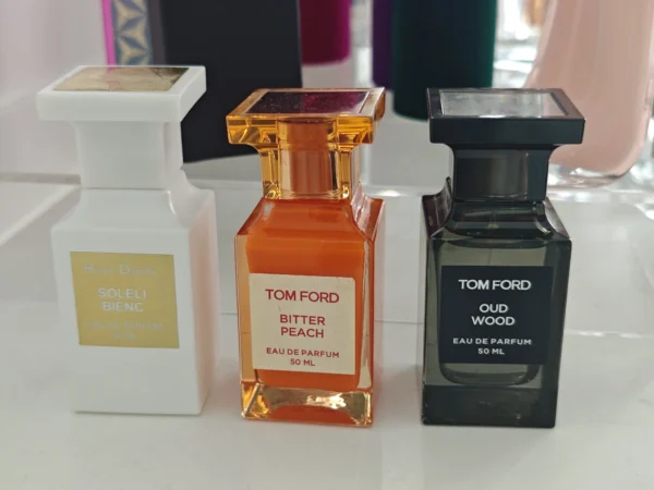 Side-by-side comparison of a $300 luxury unisex perfume and a direct-to-consumer Extrait de Parfum showing identical GC-MS fragrance note breakdowns.