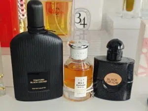Visual breakdown of fragrance notes and Parfum concentration longevity, comparing an expensive designer brand bottle with the IMIXX No. 32 Extrait de Parfum alternative.