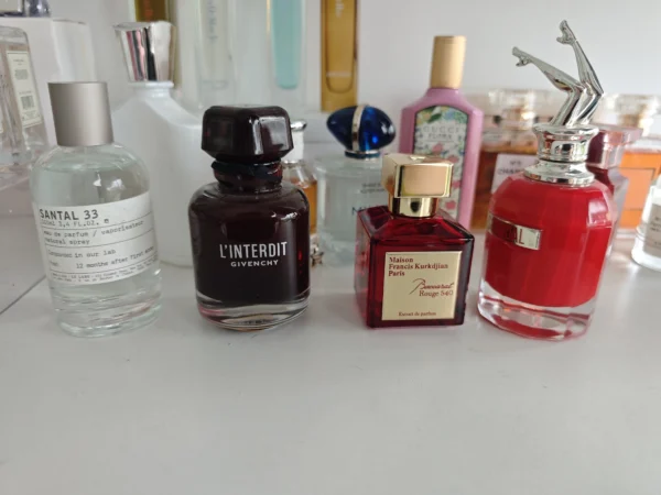 Visual comparison of a traditional luxury unisex perfume and a premium factory-direct fragrance alternative.