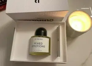 Side-by-side comparison of a $300 luxury niche perfume and a premium factory-direct Byredo Mixed Emotions dupe.