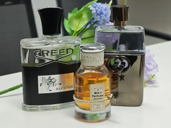 comparison of a $300 luxury niche fragrance bottle next to a high-quality Creed Acqua Fiorentina dupe from a factory-direct brand.