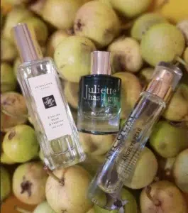 Side-by-side comparison of a traditional luxury cologne and a long-lasting English Pear and Freesia Eau de Parfum alternative.
