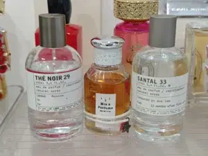 Side-by-side fragrance notes comparison highlighting the fig, cedar, and black tea accords in premium US alternatives