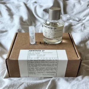 Chemical composition and scent note comparison showing the Ambroxan and Iso E Super levels in high-end skin scents versus Imixx Perfumes' Another 13 Cologne.