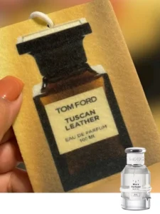 Side-by-side comparison of a $300 luxury designer leather fragrance and a high-quality, affordable ombre leather dupe alternative.