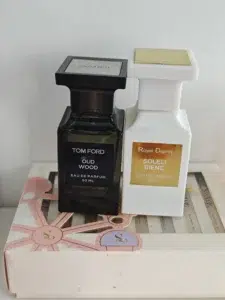 Side-by-side comparison of a luxury Tom Ford Oud Wood bottle and a transparently priced, high-concentration alternative dupe by IMIXX.
