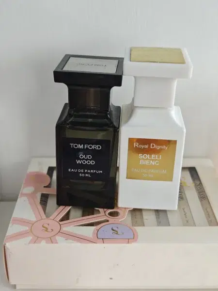 Side-by-side comparison of a luxury Tom Ford Oud Wood bottle and a transparently priced, high-concentration alternative dupe by IMIXX.