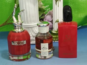Factory-direct Inspired by Si Eau de Parfum bottle next to a designer fragrance, highlighting the difference in retail markup and oil concentration.