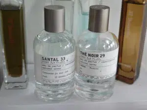 Side-by-side cost breakdown comparison of a luxury Le Labo perfume versus a premium USA inspired-by alternative fragrance.