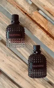Cost breakdown comparison showing a luxury designer fragrance bottle versus an affordable factory-direct perfume alternative in the USA.