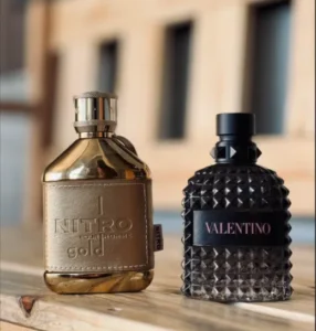 Side-by-side comparison of designer Valentino Born in Roma perfume and a high-quality Extrait de Parfum dupe bottle.