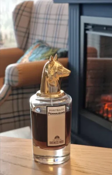 Side-by-side visual comparison of a luxury $300 niche perfume and a high-quality affordable Duchess Rose alternative bottle.
