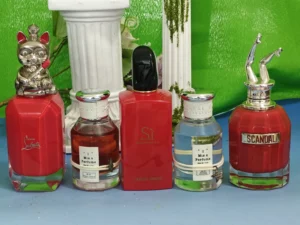 Visual comparison of synthetic ingredients and retail markups in commercial fragrances versus the transparent, botanical formulation of Imixx Perfumes.