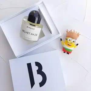 How to Find the Perfect Byredo Velvet Haze Dupe: A Formulation Expert’s Guide to Earthy Coconut & Patchouli in the USA 2 IMIXX Perfumes inspired by Velvet Haze next to the original designer bottle, showcasing the shared earthy notes of coconut water, patchouli fraction, and raw cacao.