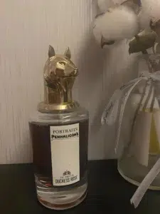Side-by-side comparison of a $300 luxury rose fragrance bottle and an affordable niche perfume alternative in the USA.