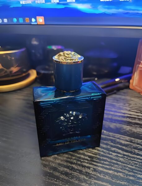 Side-by-side cost and packaging comparison between an expensive designer cologne and a high-quality, affordable factory-direct fragrance alternative.