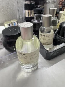 A side-by-side comparison of a $300 luxury petrichor perfume and a high-concentration factory alternative.