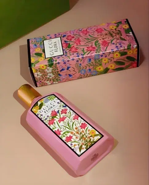 Side-by-side comparison of an authentic luxury Gucci Flora Gorgeous Gardenia bottle and a high-quality, long-lasting affordable perfume dupe alternative.
