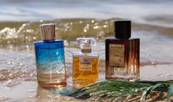 Side-by-side comparison of a $135 luxury designer perfume bottle and a premium factory-direct Juliette Has a Gun dupe formulated with pure Cetalox.
