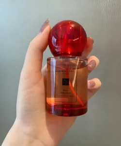 Jo Malone Red Hibiscus and IMIXX perfume alternative shown side by side