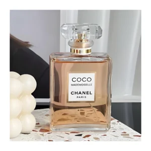 Side-by-side comparison of a $150 luxury designer perfume and an affordable, long-lasting Coco Mademoiselle dupe by IMIXX Perfumes.