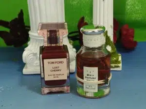Luxury cherry perfume bottle compared side by side with an affordable inspired fragrance