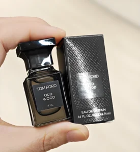 Tom Ford Oud Wood luxury perfume and an affordable woody fragrance alternative side by side